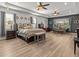 Spacious main bedroom with a king-size bed and sitting area at 19270 Briarbrook Dr, Tampa, FL 33647