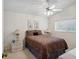 Bright bedroom with a double bed and ceiling fan at 2231 Utopian E Dr # 321, Clearwater, FL 33763