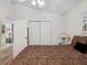 Bedroom with a double bed and access to a hallway at 2231 Utopian E Dr # 321, Clearwater, FL 33763