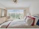 Spacious bedroom with a large bed, plenty of natural light, and a dresser at 2231 Utopian E Dr # 321, Clearwater, FL 33763