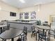 Community room with tables and chairs at 2231 Utopian E Dr # 321, Clearwater, FL 33763
