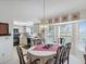 Dining room with view into kitchen and bay window at 2231 Utopian E Dr # 321, Clearwater, FL 33763