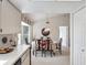 Bright dining room with a round table and chairs, offering a welcoming atmosphere at 2231 Utopian E Dr # 321, Clearwater, FL 33763