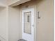 Condo building's front entrance with a white door at 2231 Utopian E Dr # 321, Clearwater, FL 33763
