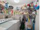 Functional laundry room with washer, dryer, and storage shelves at 2231 Utopian E Dr # 321, Clearwater, FL 33763