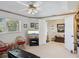 Relaxing living area with TV, comfortable seating, and access to den at 2231 Utopian E Dr # 321, Clearwater, FL 33763