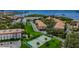 Aerial view of community tennis court and waterfront property at 2700 Bayshore Blvd # 4304, Dunedin, FL 34698