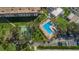 Aerial view of community pool, shuffleboard, and parking at 2700 Bayshore Blvd # 4304, Dunedin, FL 34698