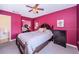 Spacious bedroom with a large bed and dark wood furniture at 2700 Bayshore Blvd # 4304, Dunedin, FL 34698