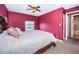Bright bedroom with a queen-size bed and ensuite bathroom access at 2700 Bayshore Blvd # 4304, Dunedin, FL 34698