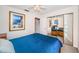 Bedroom with mirrored closet doors and a view of a courtyard at 2700 Bayshore Blvd # 4304, Dunedin, FL 34698