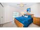Bedroom with a full-size bed, ample closet space and a window at 2700 Bayshore Blvd # 4304, Dunedin, FL 34698