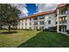 Exterior view of building with lush landscaping at 2700 Bayshore Blvd # 4304, Dunedin, FL 34698