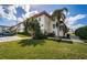 Building exterior showcasing landscaping and parking at 2700 Bayshore Blvd # 4304, Dunedin, FL 34698