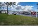 Building exterior with parking and landscaping at 2700 Bayshore Blvd # 4304, Dunedin, FL 34698