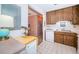 Galley kitchen with wood cabinets and a convenient pass-through at 2700 Bayshore Blvd # 4304, Dunedin, FL 34698