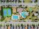 Aerial view of the community with tennis courts, basketball court, pool and clubhouse at 33975 Astoria Cir, Wesley Chapel, FL 33545