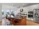 Bright kitchen features a large island, stainless steel appliances, and white cabinets at 33975 Astoria Cir, Wesley Chapel, FL 33545