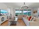 Bright living room featuring recessed lighting, hardwood flooring, a sectional sofa, and a sliding glass door at 33975 Astoria Cir, Wesley Chapel, FL 33545