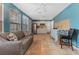 Small kitchenette with white cabinets and a refrigerator at 4075 Velarde Ln, Sarasota, FL 34235