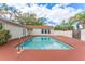 Clean lines and a refreshing blue pool at 4075 Velarde Ln, Sarasota, FL 34235