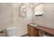 Small bathroom with a sink, toilet, and water heater at 5105 N 45Th St, Tampa, FL 33610