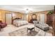 Spacious bedroom with a chaise lounge and tiled floors at 5105 N 45Th St, Tampa, FL 33610