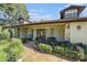 Charming home exterior featuring stone accents, dormer windows, and covered entryway at 5105 N 45Th St, Tampa, FL 33610