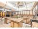 Bright kitchen with a unique lighting fixture, a central island, and ample cabinet space at 5105 N 45Th St, Tampa, FL 33610