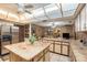 Spacious kitchen with stainless steel appliances, a large island, and stone countertops at 5105 N 45Th St, Tampa, FL 33610