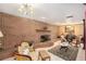 Living room with brick fireplace and antique furniture at 5105 N 45Th St, Tampa, FL 33610