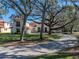 House exterior showcasing a grand entrance and lush landscaping at 5212 Golf Links Blvd, Zephyrhills, FL 33541