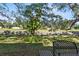 Backyard with a bench, trees, and a canal view at 7075 Lafayette N, Pinellas Park, FL 33781