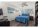 Spacious bedroom with ceiling fan and wood flooring at 7075 Lafayette N, Pinellas Park, FL 33781