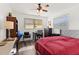 Bedroom with red bedding and ample closet space at 7075 Lafayette N, Pinellas Park, FL 33781