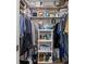 Walk-in closet with organized shelving and hanging storage for clothing and accessories at 7075 Lafayette N, Pinellas Park, FL 33781