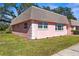 Charming single-story home with a well-maintained lawn and mature shade trees at 7075 Lafayette N, Pinellas Park, FL 33781