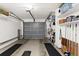 Attached garage with storage shelving and flooring at 7075 Lafayette N, Pinellas Park, FL 33781