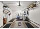 Organized garage space featuring epoxy floor, washer/dryer, and shelving for ample storage at 7075 Lafayette N, Pinellas Park, FL 33781