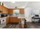 Cozy kitchen features wood cabinets and a breakfast bar at 7075 Lafayette N, Pinellas Park, FL 33781