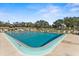 Inviting community pool with lounge chairs at 7075 Lafayette N, Pinellas Park, FL 33781
