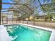 Relaxing screened-in pool with a spacious deck at 8139 Wooden Dr, Spring Hill, FL 34606