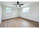 Spacious bedroom with ceiling fan and wood-look flooring at 8718 94Th St, Seminole, FL 33777