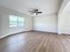 Spacious living room with light walls and wood-look floors at 8718 94Th St, Seminole, FL 33777