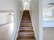 Modern staircase with light wood treads leading to the upper level at 8718 94Th St, Seminole, FL 33777