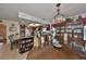 Spacious dining area featuring a large wooden table and a china cabinet at 909 Sun Key Ct, Sun City Center, FL 33573