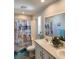 Bathroom has a double vanity, a shower/tub combo, and beach-themed decor at 919 50Th W Ave, Bradenton, FL 34207