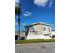 Tan single-wide manufactured home with white trim and a palm tree in the front yard at 919 50Th W Ave, Bradenton, FL 34207