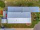 Aerial view of a mobile home with metal roof and covered carport at 118 Saint Pierres Way, Apollo Beach, FL 33572