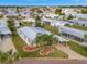 Single-wide home with carport, landscaping, and community view at 118 Saint Pierres Way, Apollo Beach, FL 33572